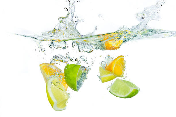 istock Cut up pieces of citrus' splashing into water  121654111