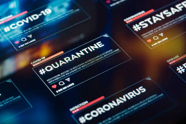Photo of #quarantine hashtag for social networks close-up on digital display