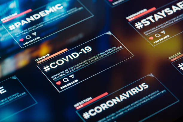 istock #COVID-19 hashtag for social networks close-up on digital display 1216542063