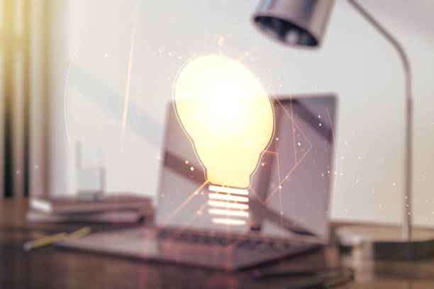 istock Creative idea concept with light bulb illustration on modern laptop background. Multiexposure 1216542182