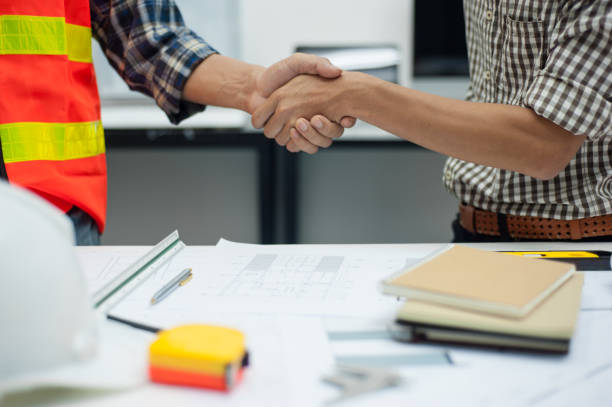 istock Engineers, architects and contractors agree to work together. 1216542618