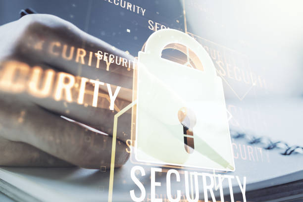 istock Creative idea concept with lock symbol and microcircuit illustration and with man hand writing in notebook on background. Protection and firewall concept. Multiexposure 1216542906