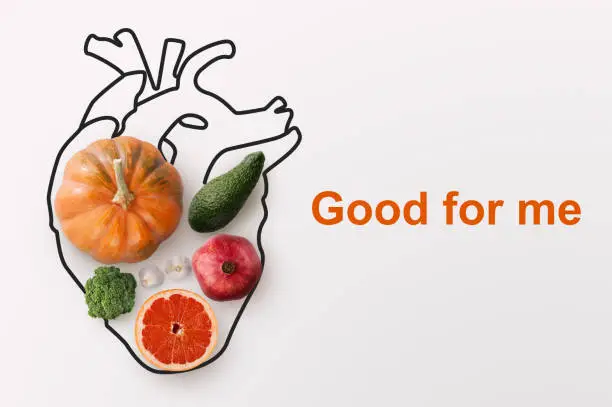 Photo of Healthy nutrition and cardiology. Creative collage with fruits, vegetables and heart drawing on white background