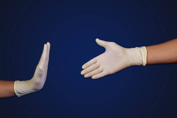 istock The doctor stopped shaking hands with protective gloves with copy space, corona virus concept 1216543657