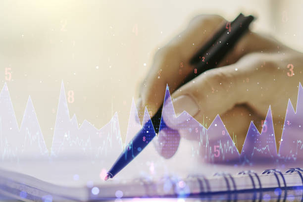 istock Double exposure of abstract creative statistics data hologram with woman hand writing in notepad on background, analytics and forecasting concept 1216543793