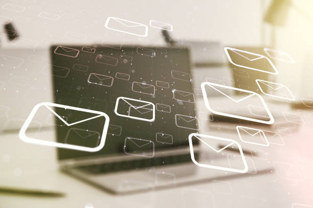 istock Double exposure of postal envelopes hologram on laptop background. Electronic mail and spam concept 1216543850