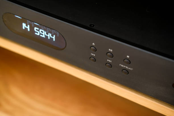istock Close-up of the buttons on a high-end, slot loading music CD player. 1216545208