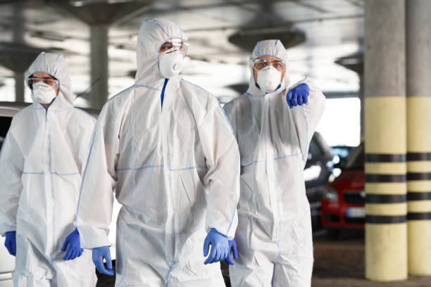 istock Men in hazmat suits pointing at you, epidemic, quarantine 1216546871