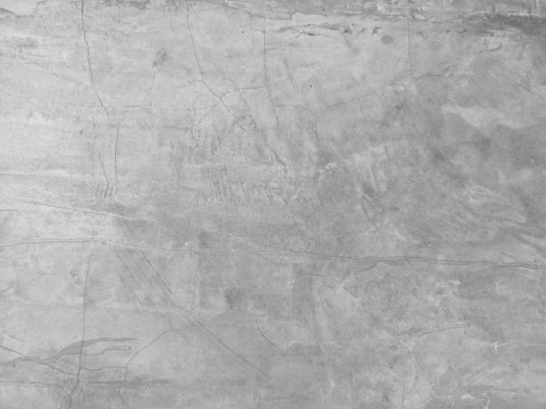 istock Cracks on the Cement wall has gray color and smooth abstract surface texture concrete material background 1216546892