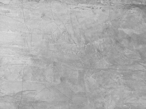 Cracks on the Cement wall has gray color and smooth abstract surface texture concrete material background