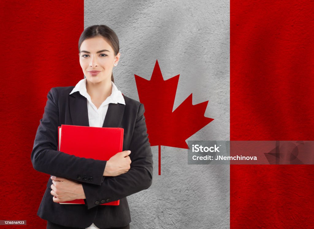 banner with flag Canada. Travel and learn english or franch language Optimistic girl against Canadian flag. Distance learning in Canada Adult Stock Photo