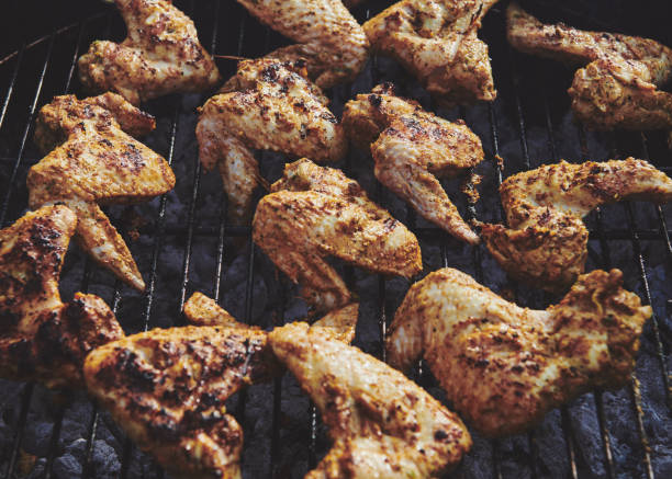 istock Full Frame Shot Of Chicken Wings On Barbecue 1216547192