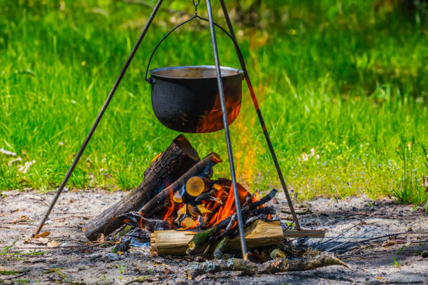 istock touristic cauldron on a tripod in a fire 1216549051