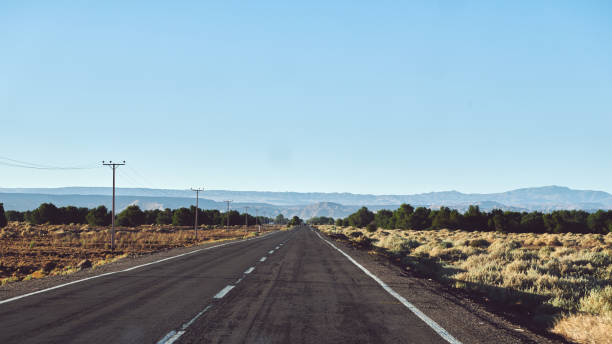 istock Road Passing Through Land Against Clear Sky 1216549338