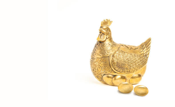 istock Golden Hen and Golden Eggs on white background 1216550696