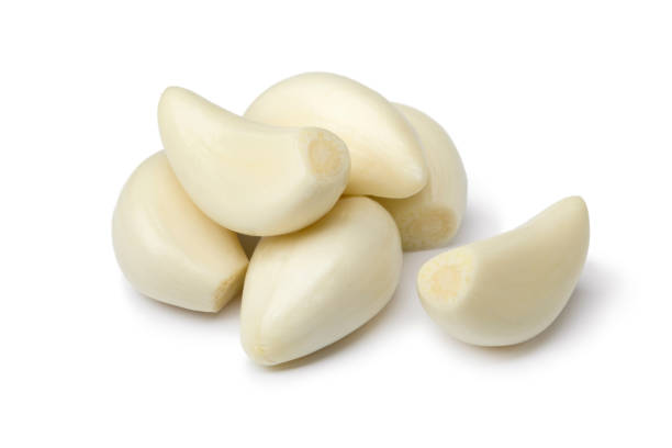 Fresh whole peeled garlic cloves Fresh whole peeled garlic cloves isolated on white background garlic clove photos stock pictures, royalty-free photos & images