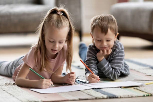 istock Two little children siblings involved in creative activity hobby. 1216554263