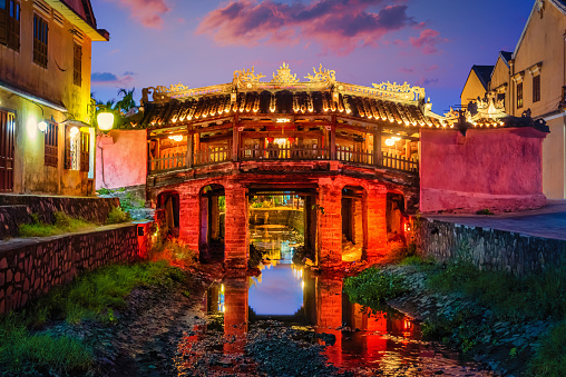Hoi An Ancient Town. Illuminated Japanese Covered Bridge over Hoi An Sea Channel in the old city of Hoi An, Vietnam, East Asia