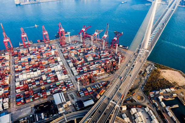 istock Highway Bridge in Hong Kong and Container Cargo freight ship 1216554973