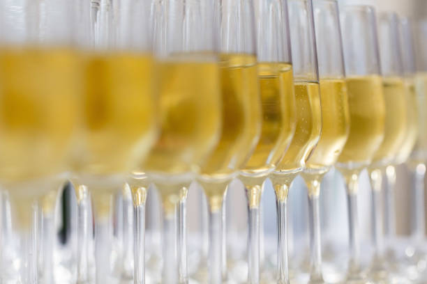 istock champagne glasses in a row filled with champagne 1216555831