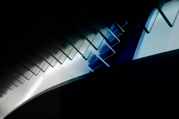 istock Computer graphic image of architectural object resembling glass balustrade or partition in twilight. Abstract modern architecture background in hi-tech style with transparent angular elements. 1216556005