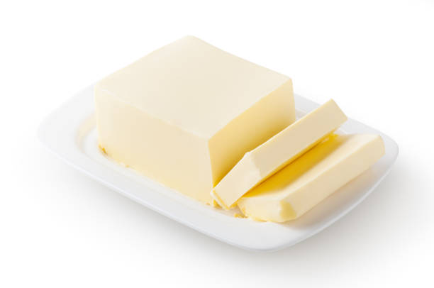 istock Fresh butter on white butter dish isolated on white background with clipping path 1216556026