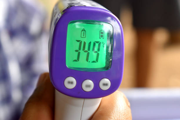 istock Infrared forehead thermometer (thermometer gun) showing temperature 1216556452