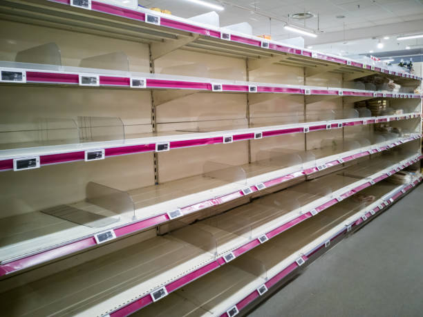 Empty shelves in supermarket store due to coronavirus covid-19 outbreak panic. Food supply shortage in Paris France Empty shelves in supermarket store due to coronavirus covid-19 outbreak panic. Food supply shortage in Paris France sold out photos stock pictures, royalty-free photos & images