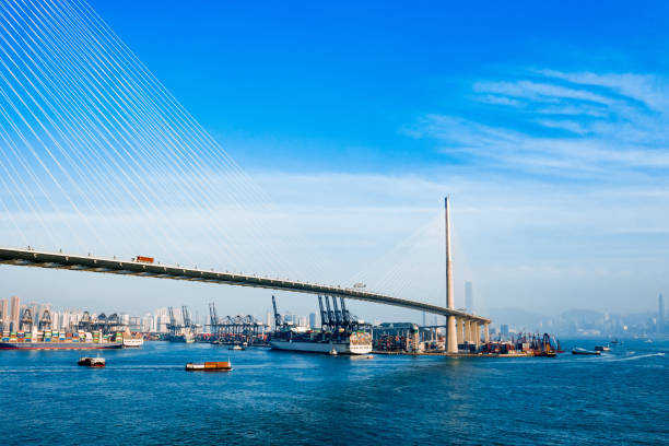 istock Highway Bridge in Hong Kong and Container Cargo freight ship 1216558167