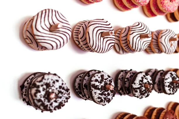 istock wedding chocolate donuts for guests. festive concept. sweets on a wedding day. wedding donuts. A yummy donut wall. 1216562356