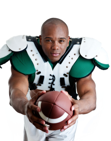 Football player shot on white background