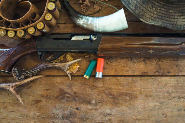 istock Hunter's equipments on old wooden background 1216565374