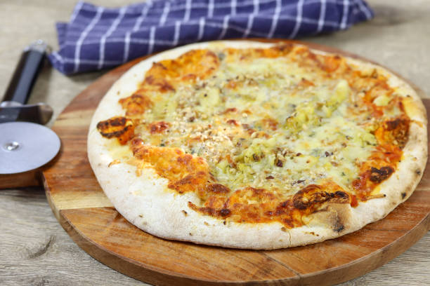 istock gorgonzola and hazelnut pizza on a cutting board 1216566116
