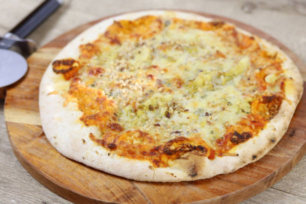 istock gorgonzola and hazelnut pizza on a cutting board 1216566137