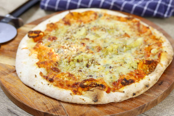 istock gorgonzola and hazelnut pizza on a cutting board 1216566170