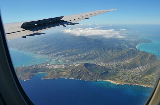 View from the plane towards iconic hawaiian volcano crater