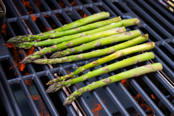 Steak and vegetables on grill at sunset, candid