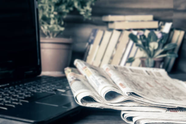 istock Media concept. Newspapers on the coffee table. 1216567380