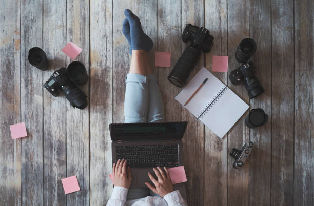 istock young photographer working from home 1216567519