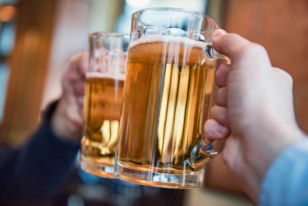 istock Close-up of two men toasting with beer 1216568900