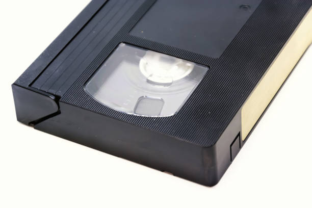 istock Detail of a VHS format videotape isolated on a white background 1216569954