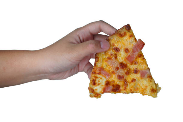 istock Hand holding pizza isolated on white background. 1216570072