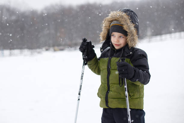 istock A boy is skiing in the mountains. 1216570575