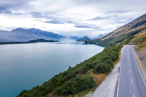 istock Empty road in mountains, aerial view 1216571835