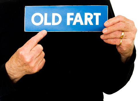 Old guy holding up 'Old Fart' sign