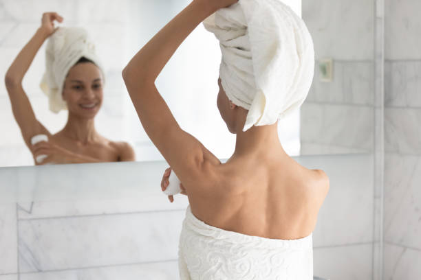 istock After shower woman apply at armpit area antiperspirant rear view 1216575384