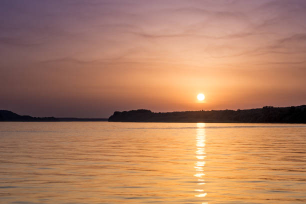 istock Beautiful abstract colorful sunset on the Danube river 1216575878
