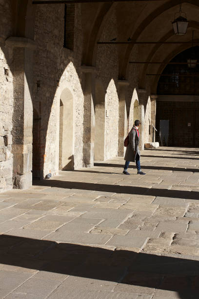 Sunlight streaming through a window, creating a distinct window-shaped shadow on the floor