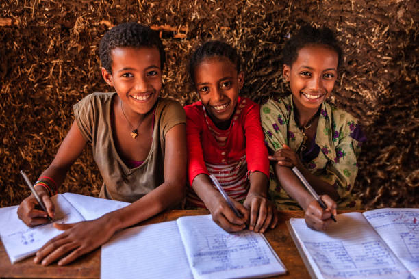 istock African children during the class, East Africa 1216575974