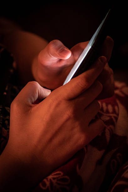 A picture of my wife's hands while playing on the phone